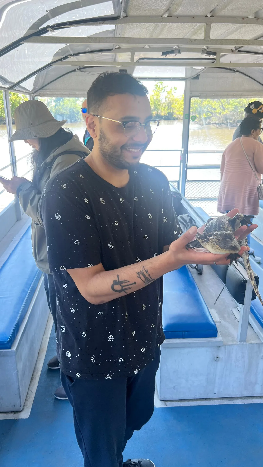 Holding a baby alligator on the bayou